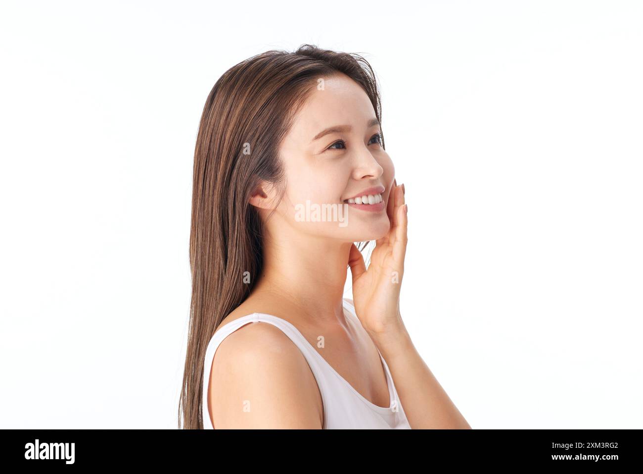 Asian Woman Smiling And Touching Her Face Stock Photo - Alamy