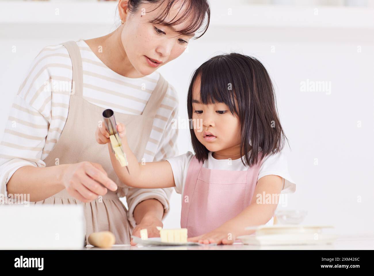 Japanese mother and daughter cooking in the kitchen Stock Photo