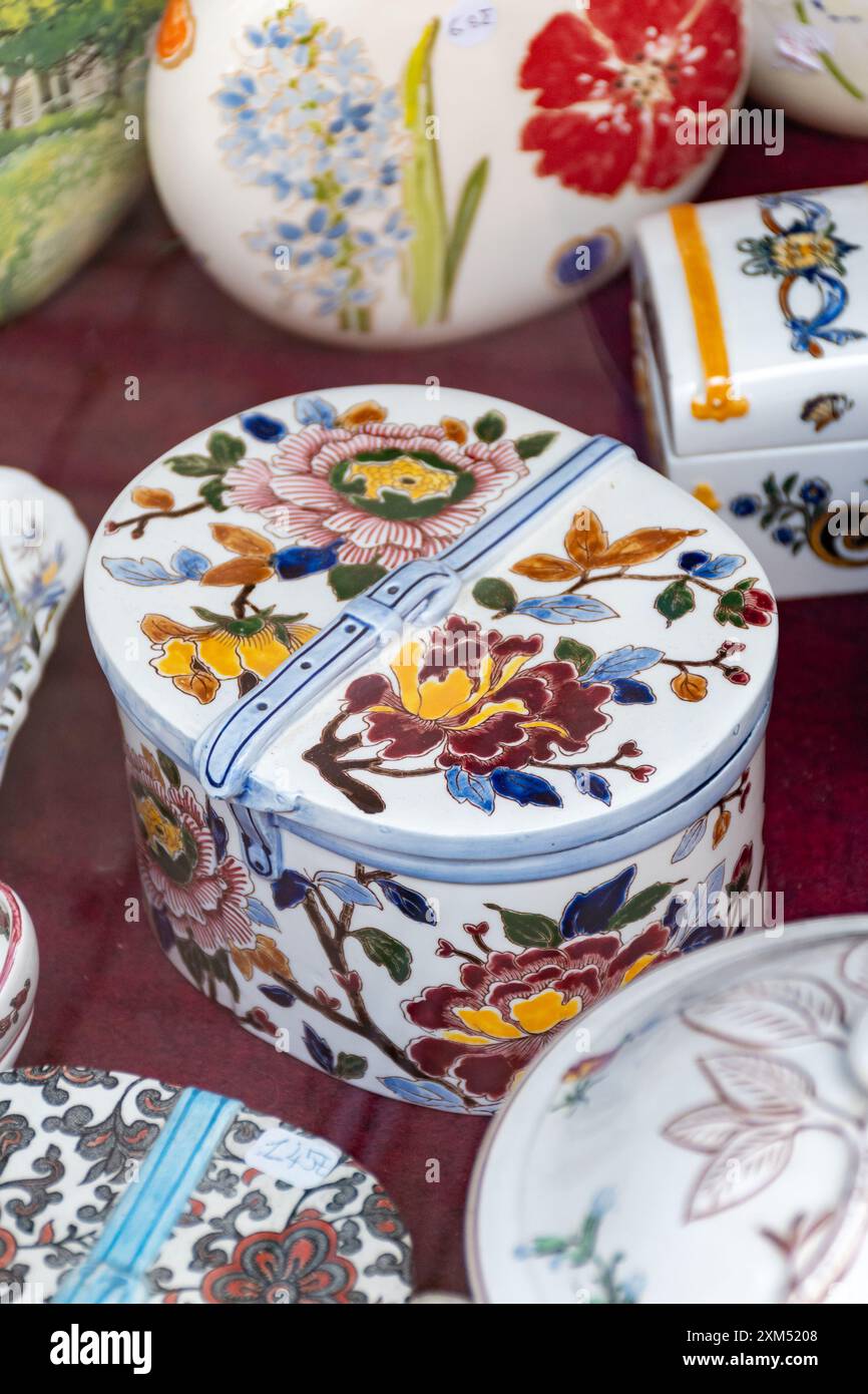 Different antique porcelaine vases and plates made in Gien on display ...