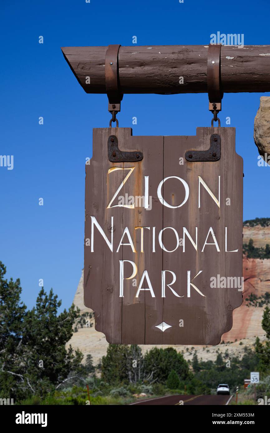 Zion National Park , UT, USA - June 20, 2024; Hanging wooden road sign for Zion National Park Stock Photo