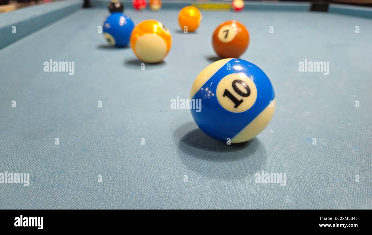 Close up of Pool balls on gray table sport game set known as eight ball pool, six pockets, cue sports. Stock Photo