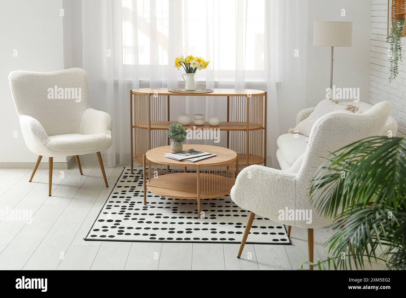 Interior of living room with cozy sofa, armchairs and coffee table ...