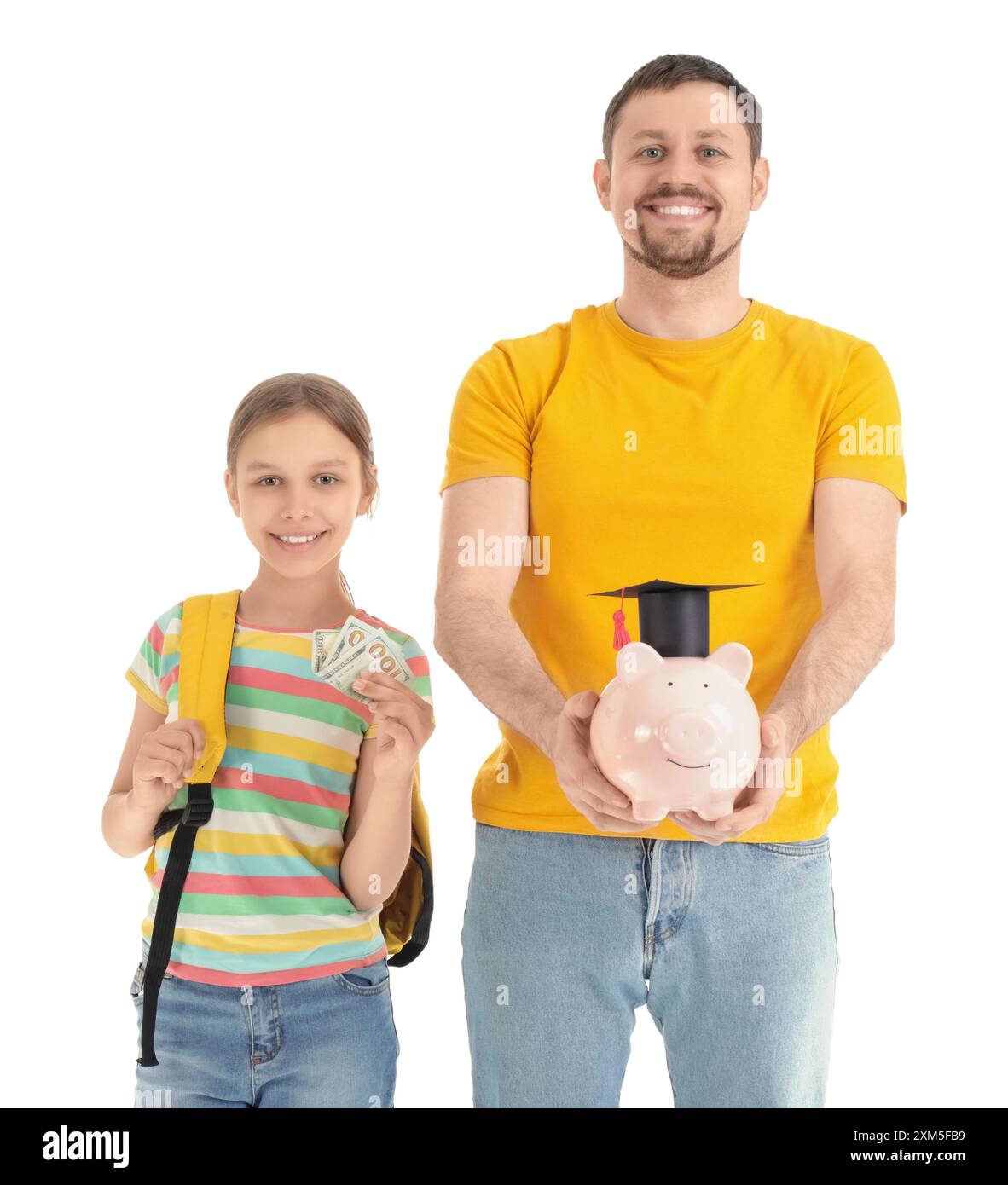 Father and his daughter with piggy bank in mortar board on white ...