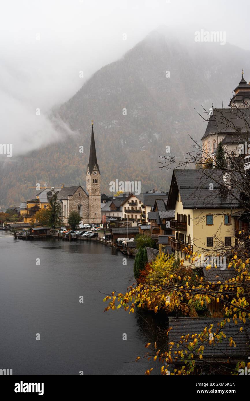 Hallstatt, Austria - October 31, 2023 : A church steeple pierces the ...
