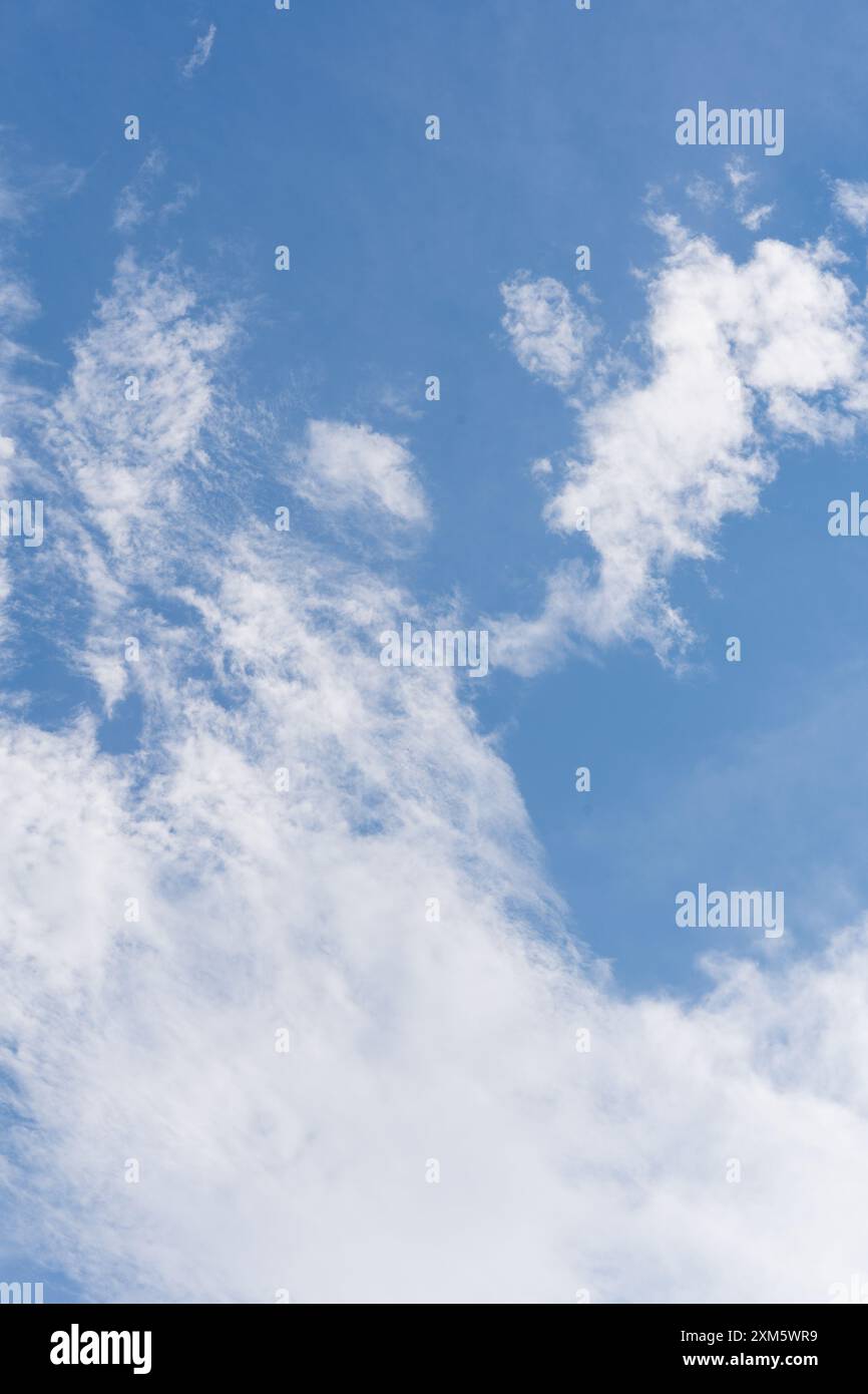 clear blue sky adorned with fluffy white clouds Stock Photo - Alamy