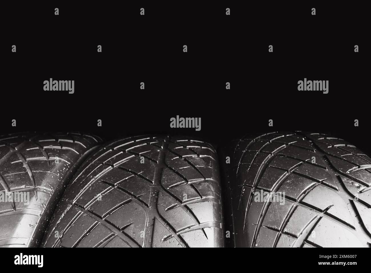 Car tire row isolated on black background with copy space for text , Old car tire with scratch , Car tire concept Stock Photo