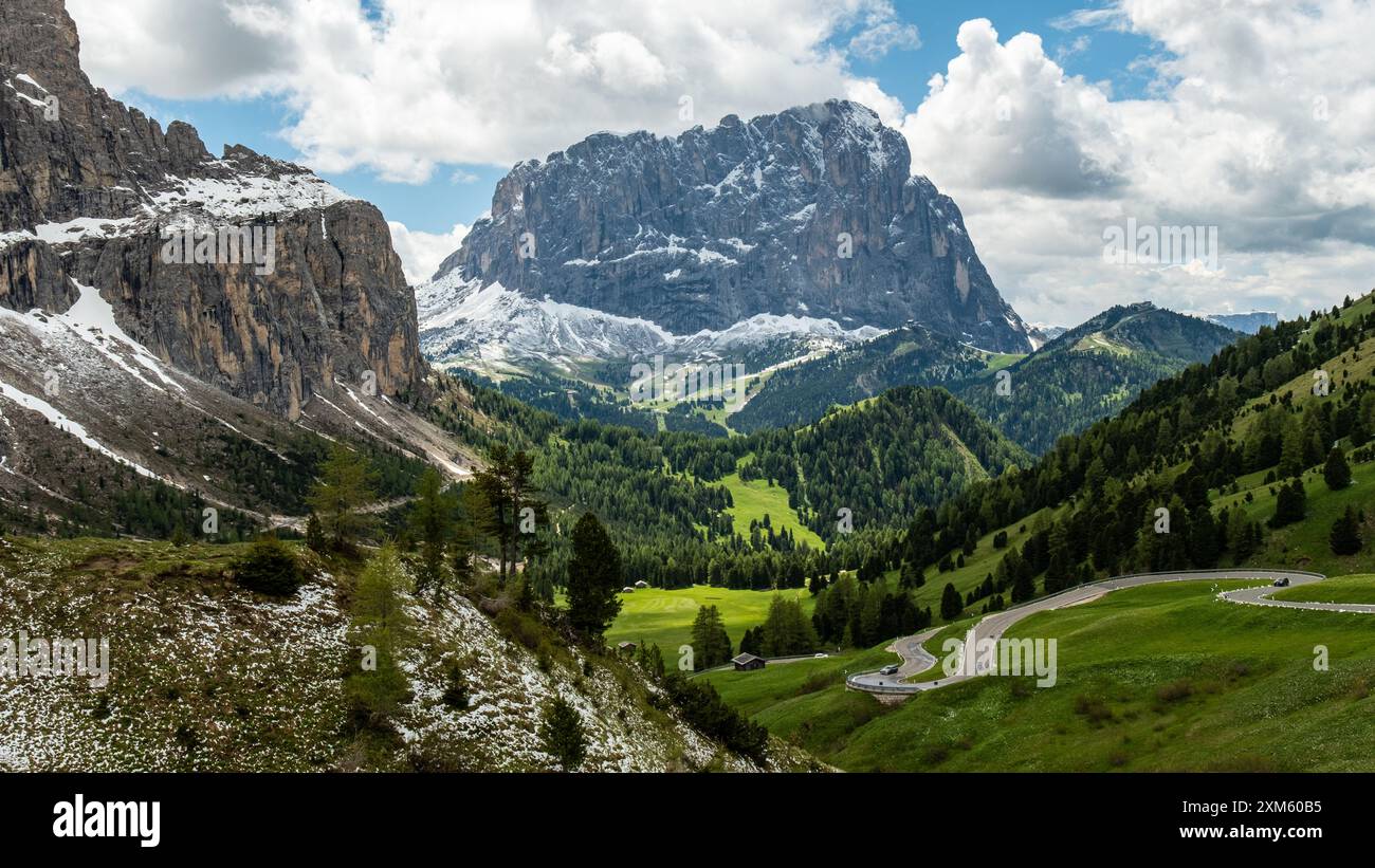 The winding road through Gardena Pass offers stunning views as it ...