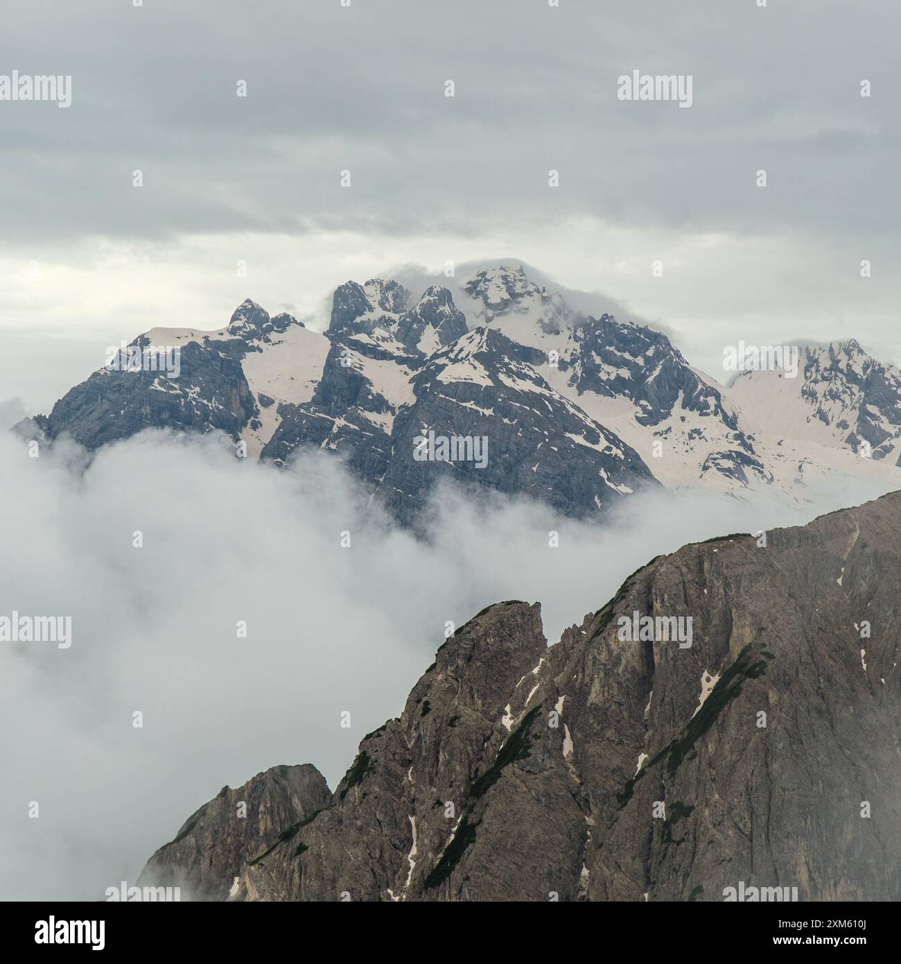 Dolomites in June: Snowy Tre Cime Circuit with peaks shrouded in ...