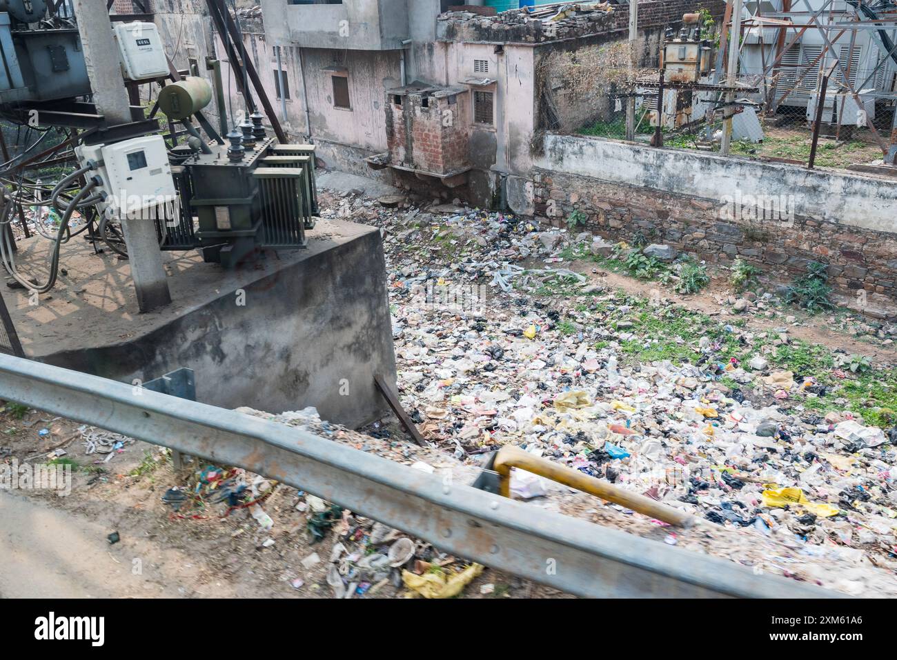 waste piling up in a ditch in city center in india Stock Photo - Alamy