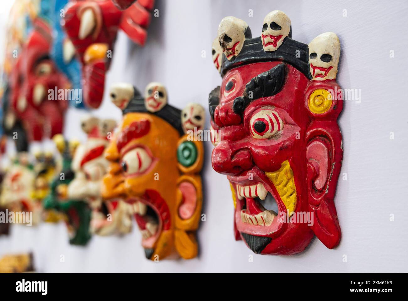 Masks of hindu deity Mahakala, a wrathful manifestation of Buddha sold at a souvenir shop in India Stock Photo