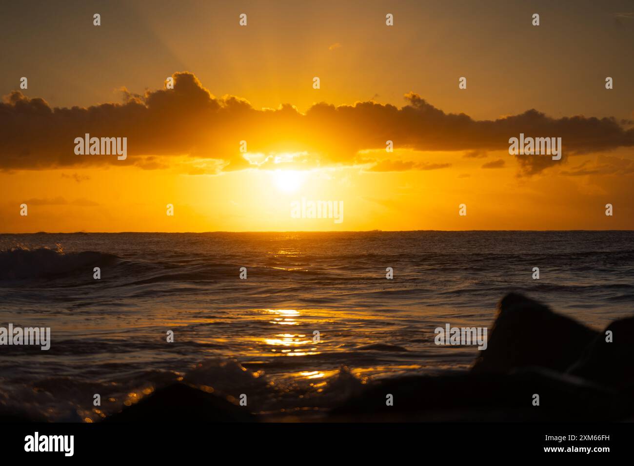 Sunrise above calm sea waves hi-res stock photography and images - Alamy