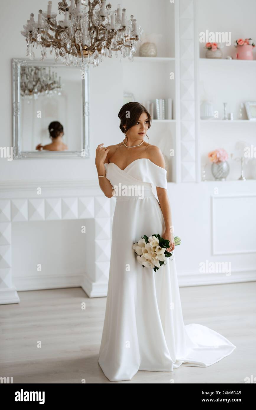 brunette bride in a tight wedding dress in a bright studio with a bouquet Stock Photo - Alamy brunette bride in a tight wedding dress in a bright studio with a bouquet Stock Photo - Alamy