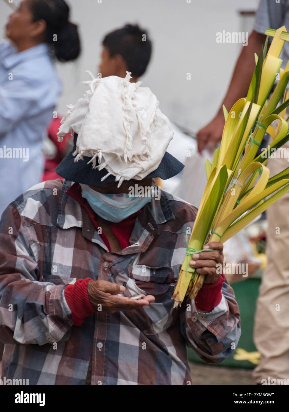 Iquitos Peru April 2022 Peruvian Woman Is Selling The Palms Made Of iquitos-peru-april-2022-peruvian-woman-is-selling-the-palms-made-of