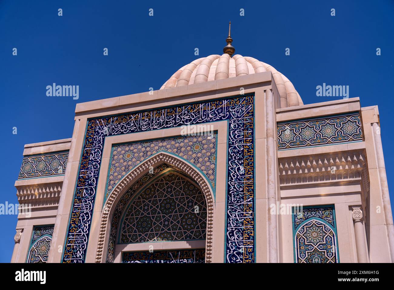 The building has a blue and white design with Arabic writing Stock ...