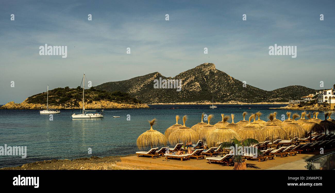 parasols-on-the-beach-of-sant-elm-view-of-the-bay-and-the-island-of-sa