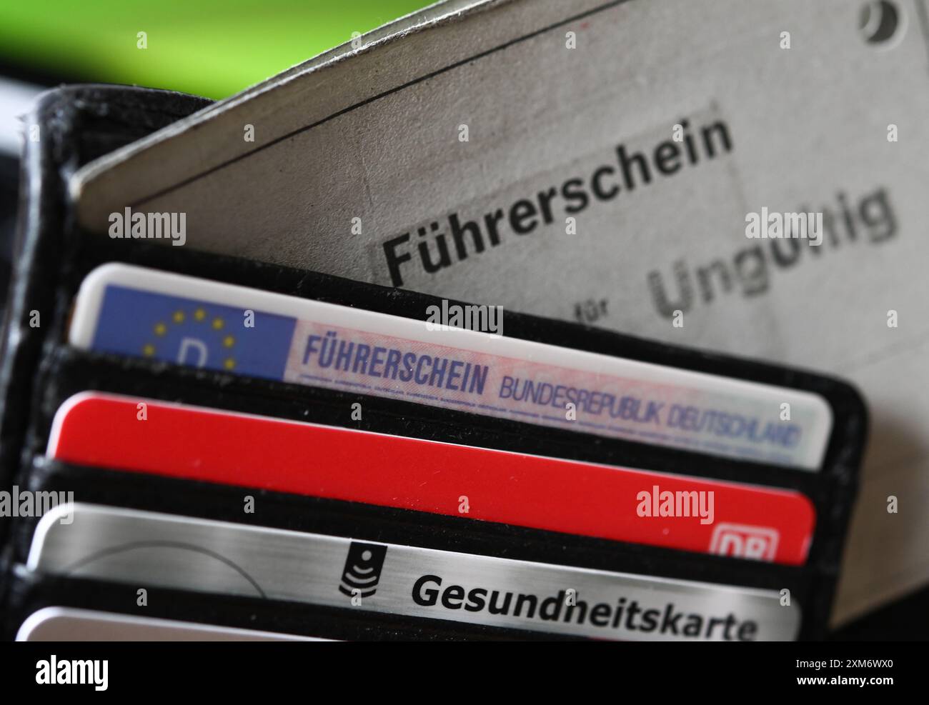 Paper License ILLUSTRATION - 26 July 2024, Hesse, Frankfurt/Main: A wallet contains a ...