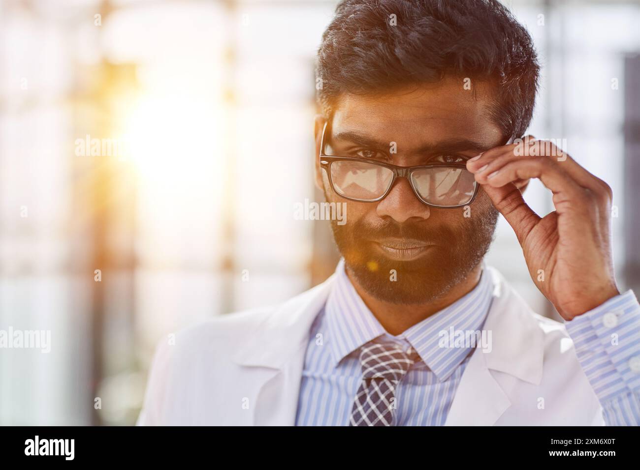 Portrait of a smiling male doctor standing in a hospital corridor Stock ...