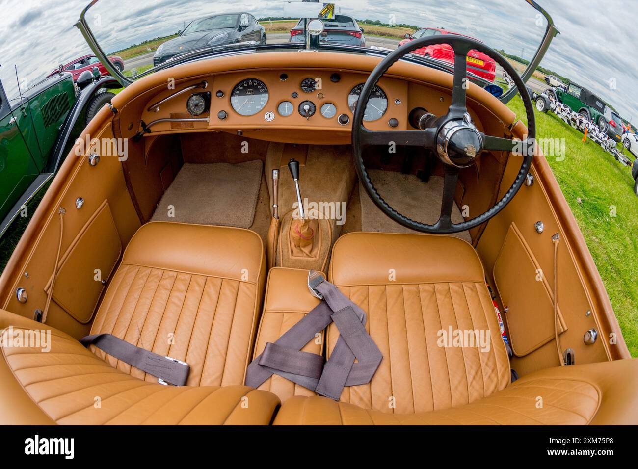 Jaguar XK 120 Roadster in British Racing green and tan leather seating, dash board. Stock Photo