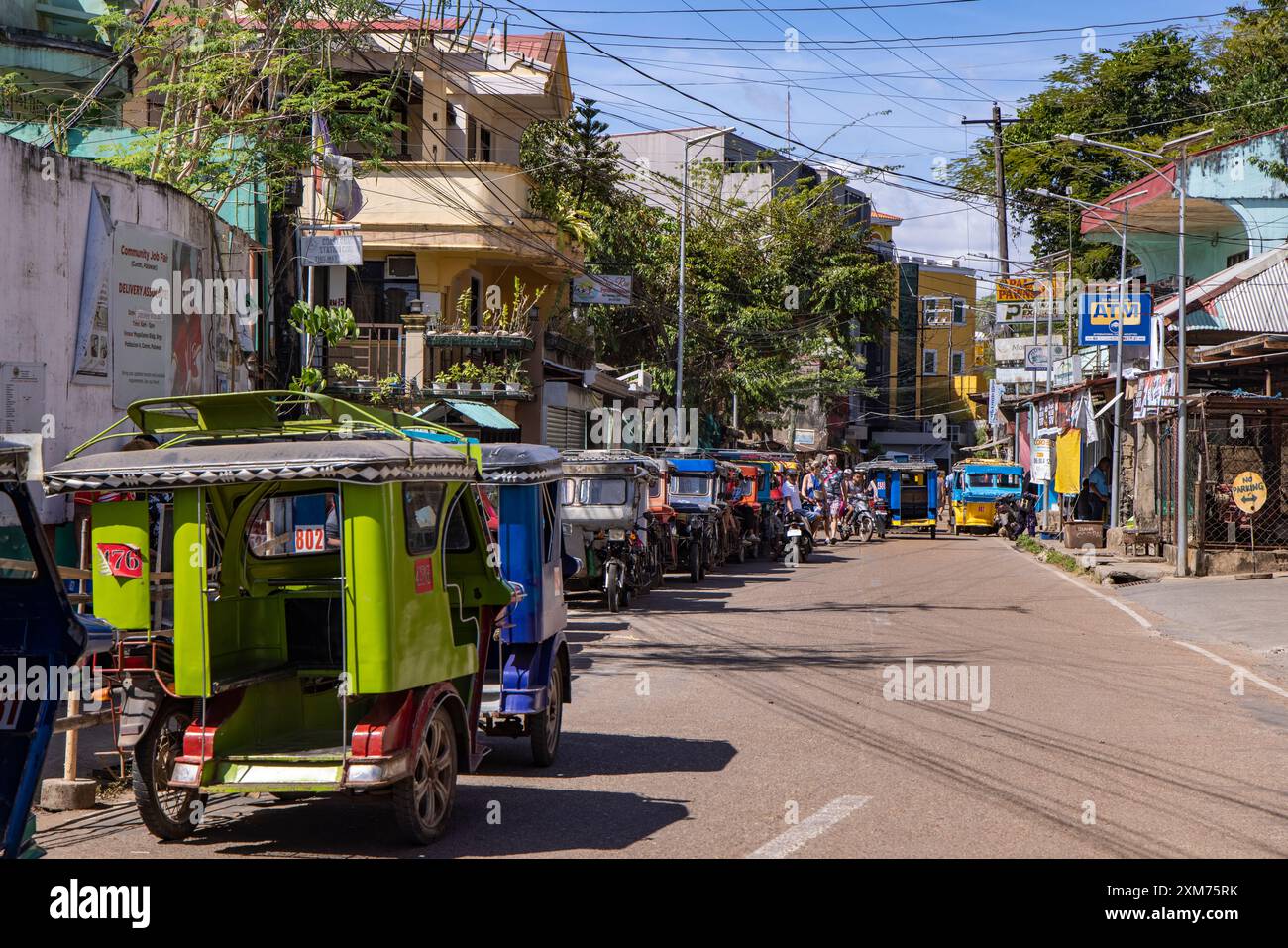 Colorful tricycle rickshaws on the street, Coron, Palawan, Philippines ...