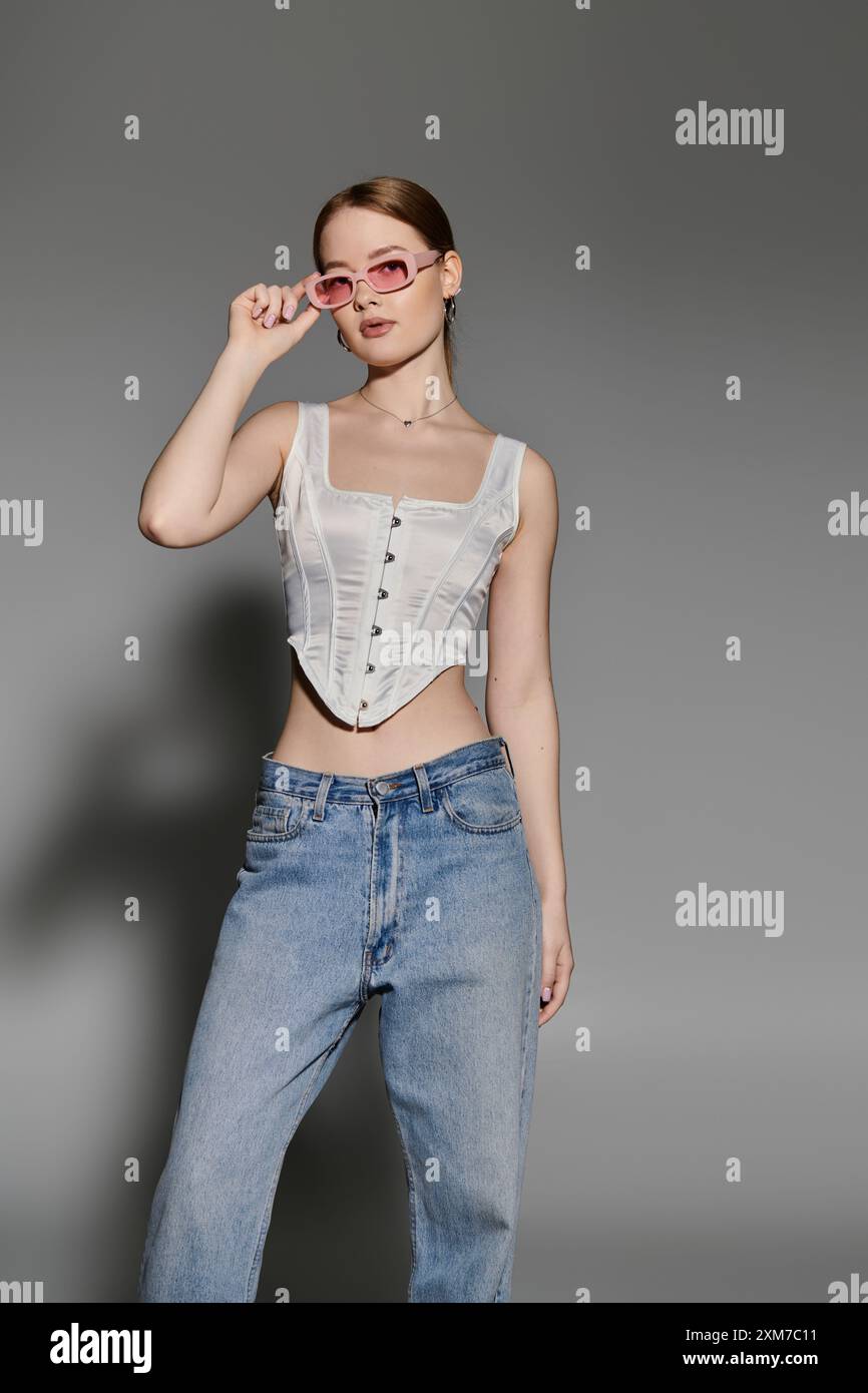 Woman wearing pink top jeans hi-res stock photography and images - Alamy