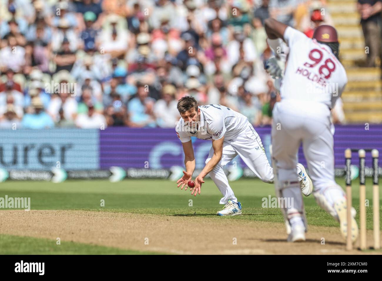 Mark Wood of England fields the ball from Jason Holder of West Indies during the 3rd Rothesay Test Match Day One match England vs West Indies at Edgbaston, Birmingham, United Kingdom, 26th July 2024  (Photo by Mark Cosgrove/News Images) Stock Photo