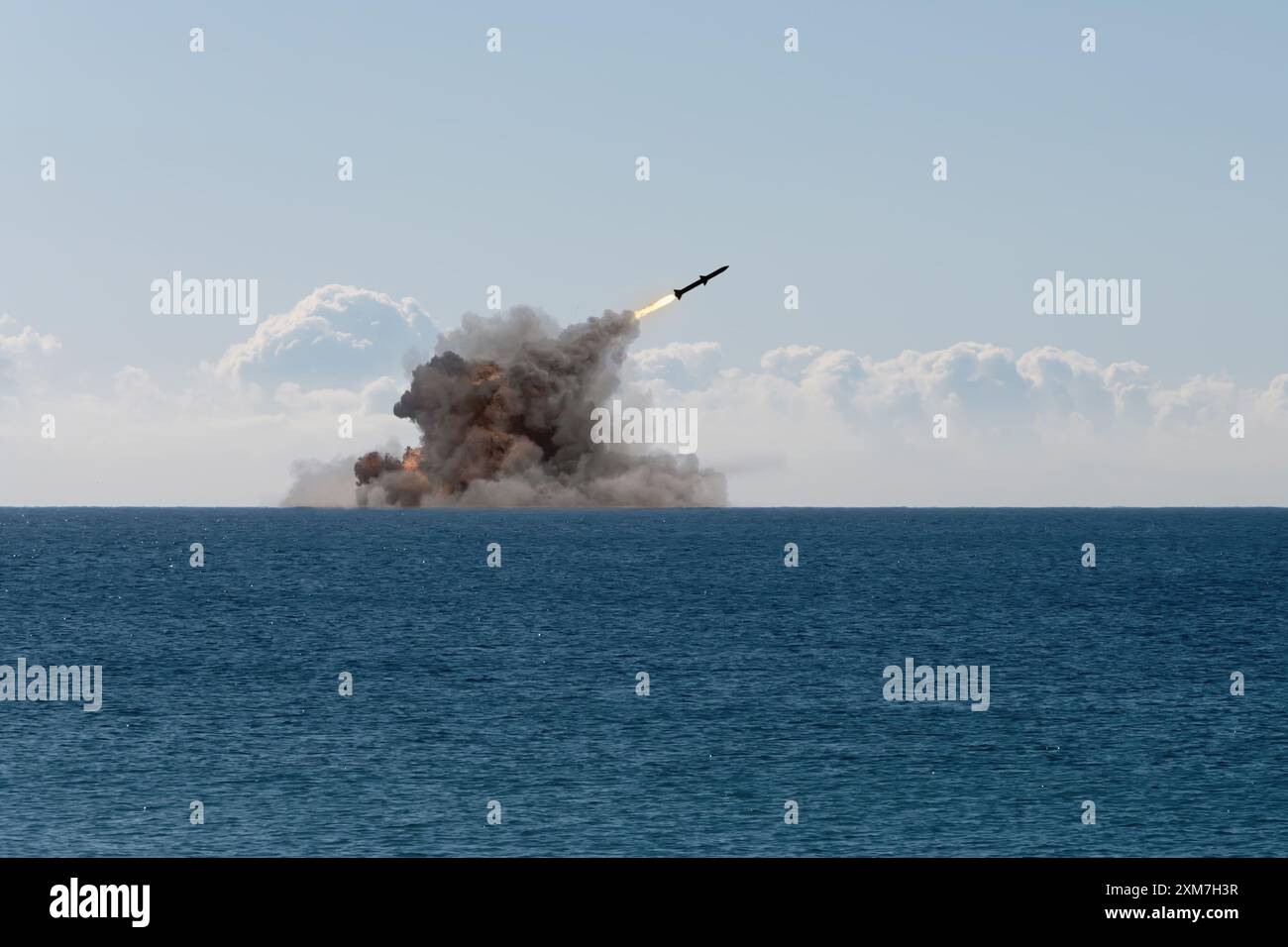 launching a ballistic missile from a warship at sea. Concept: war in Ukraine, missile attack, Russian nuclear threat. Stock Photo