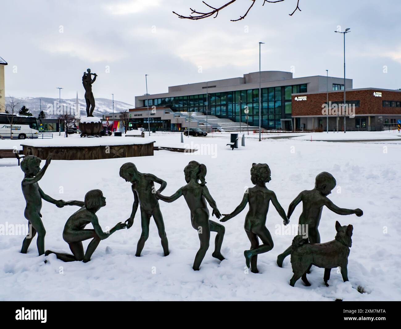 Narvik, Norway - Feb 2023 - Children Playing Statue, Statue of children holding hands by Trygve Thorsen 1962. City park Torvet in winter. Northern E Stock Photo