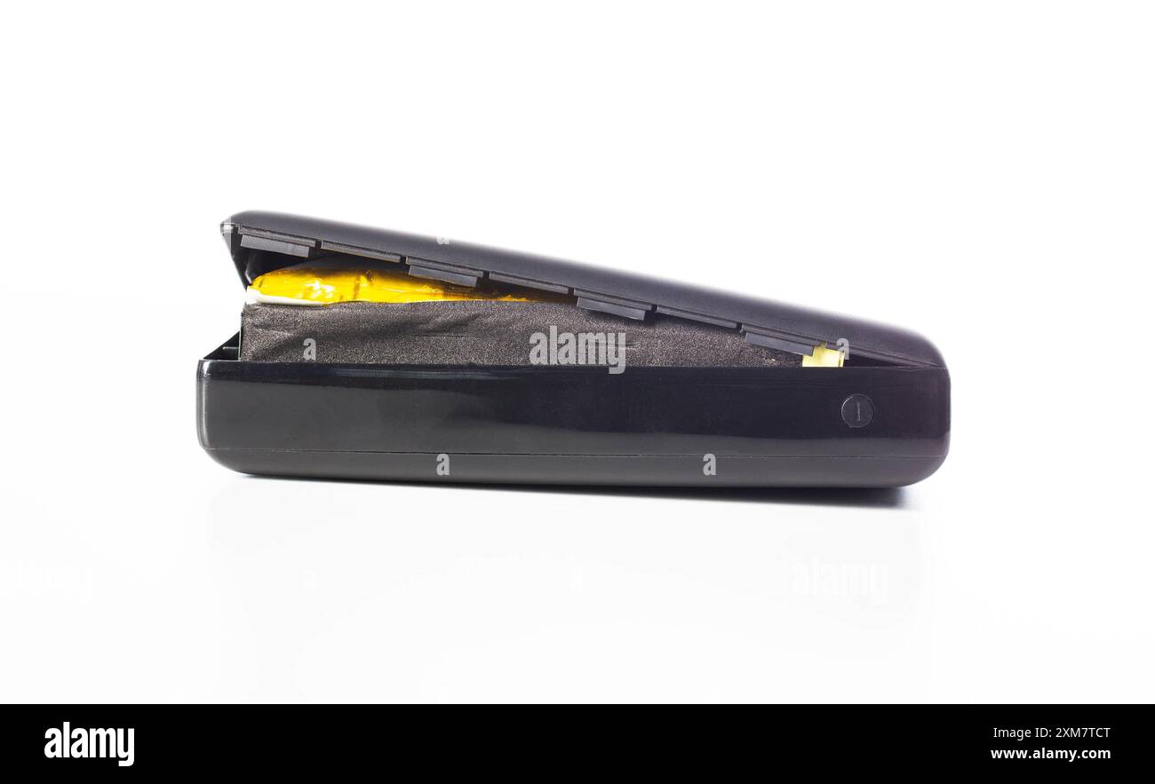 Power Banks Exploding Bloated black power bank on a white background, isolate. Danger of ...