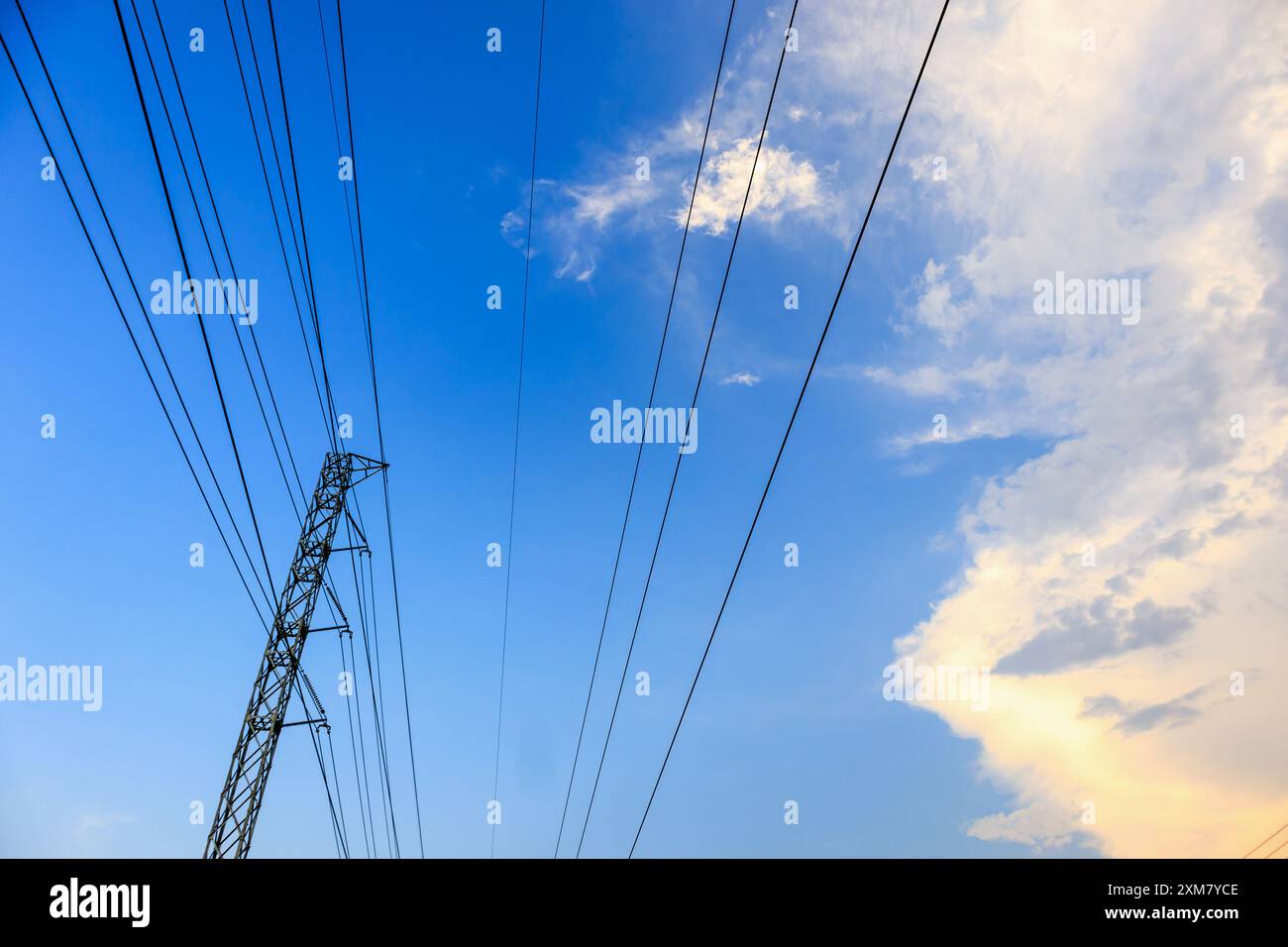 High voltage towers electric lines with clouds and sky Stock Photo - Alamy