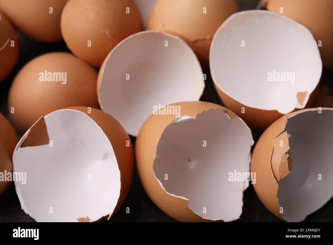 Pieces of broken eggshells on table, closeup Stock Photo