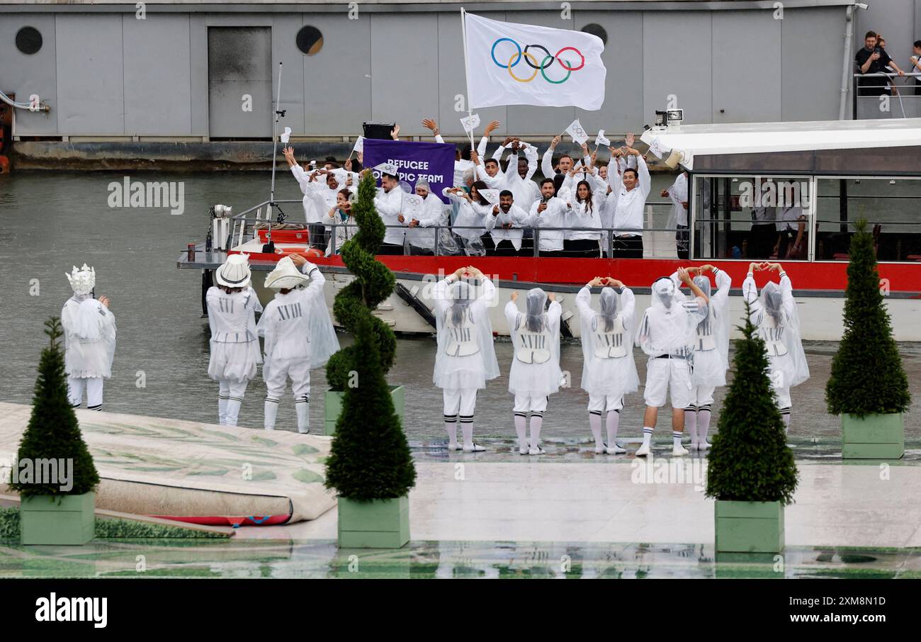 Athletes in the delegation of Refugee Olympic Team ride in a boat along ...