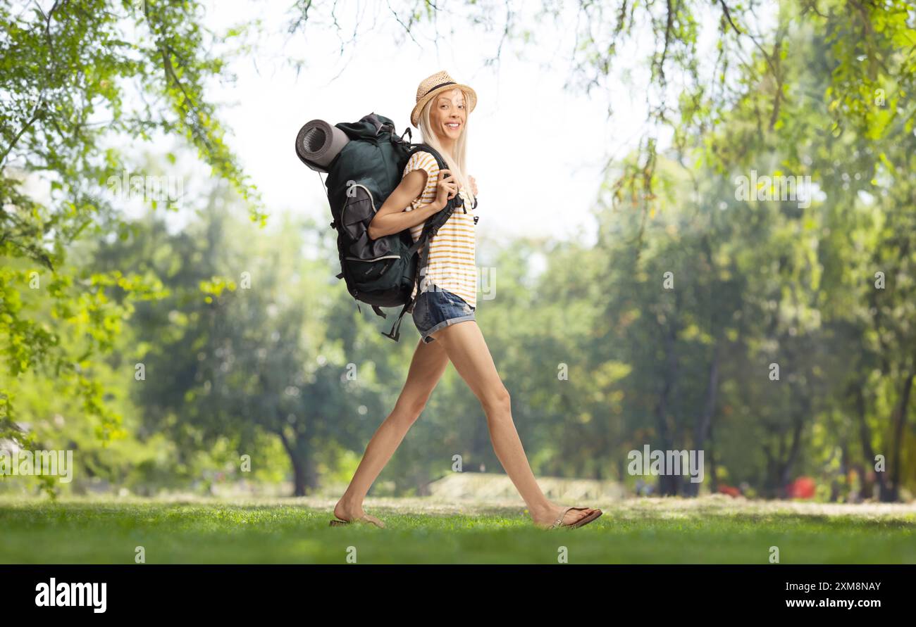 Young woman backpack in park hi-res stock photography and images - Alamy