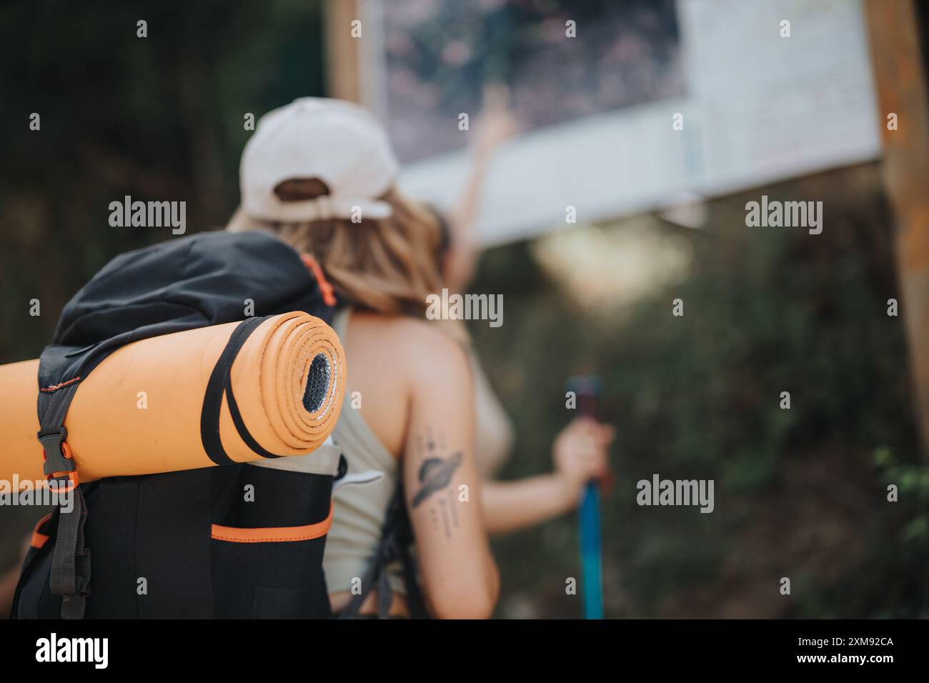 Backpackers checking hiking trail map during outdoor adventure Stock ...