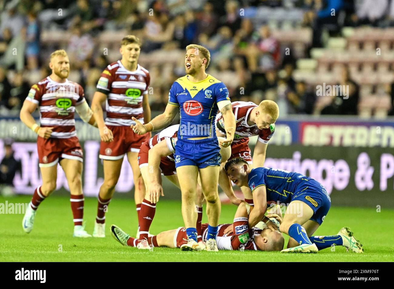 Matt Dufty of Warrington Wolves appeals innocence for his foul on Liam Marshall of Wigan Warriors during the Betfred Super League Round 19 match Wigan Warriors vs Warrington Wolves at DW Stadium, Wigan, United Kingdom, 26th July 2024  (Photo by Cody Froggatt/News Images) Stock Photo