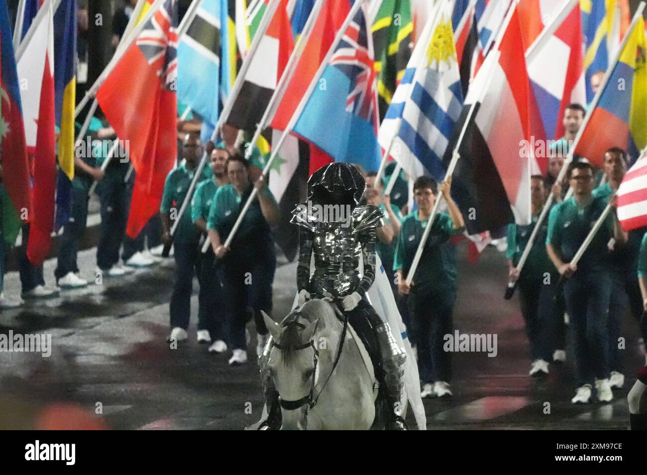 Paris, France. 26th July, 2024. The Olympic flag arrives on horseback ...