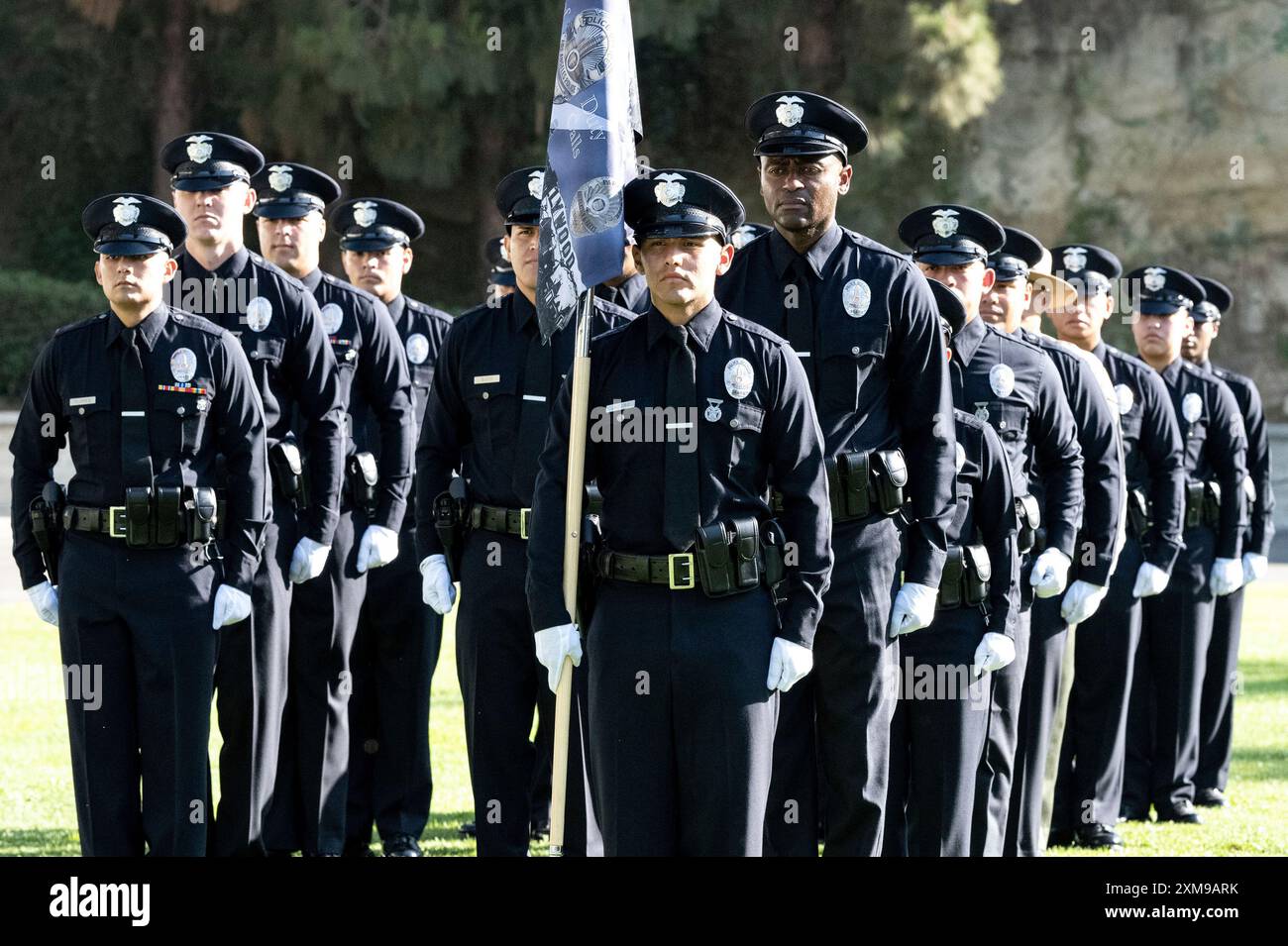 New Los Angeles Police Department officers stand during graduation