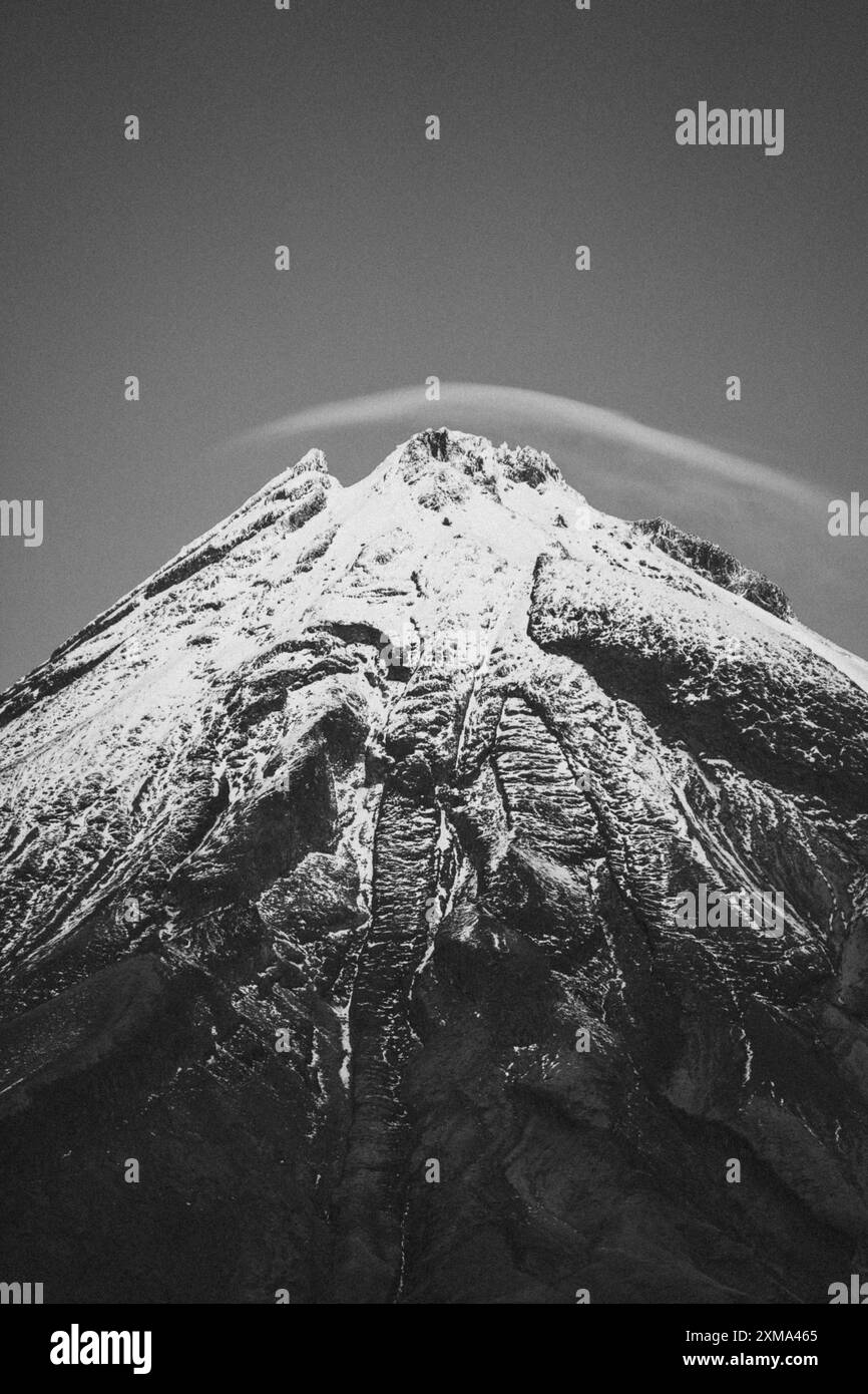 Black and white close-up of a snow-covered mountain peak, Mount Taranaki, New Zealand Stock Photo
