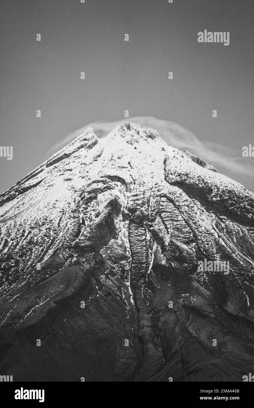 Close-up of a snow-covered mountain peak in black and white, Mount Taranaki, New Zealand Stock Photo