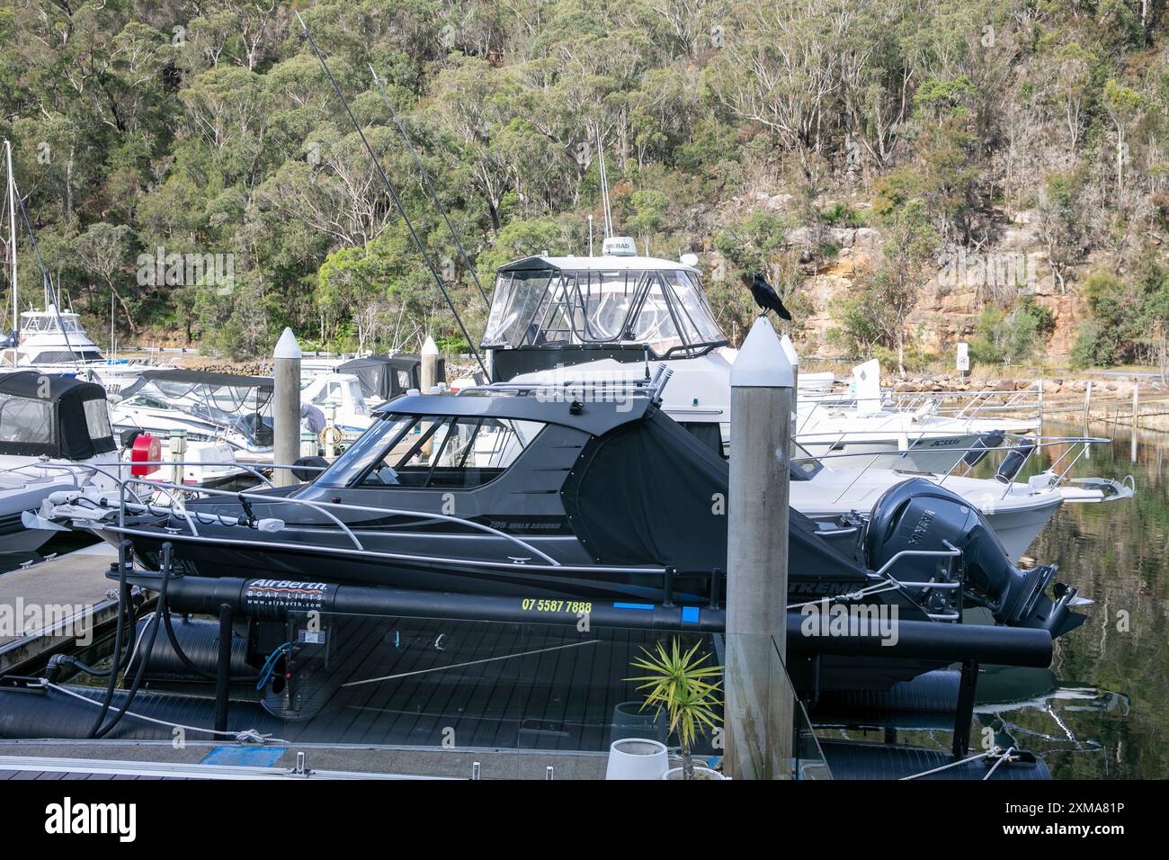 Extreme 795 walk around boat at Akuna Bay marina, berthed on an air berth in the marina,Sydney,NSW,Australia Stock Photo