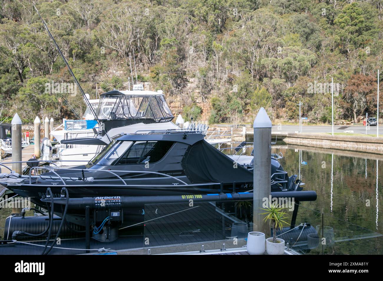 Extreme 795 walk around boat at Akuna Bay marina, berthed on an air berth in the marina,Sydney,NSW,Australia Stock Photo