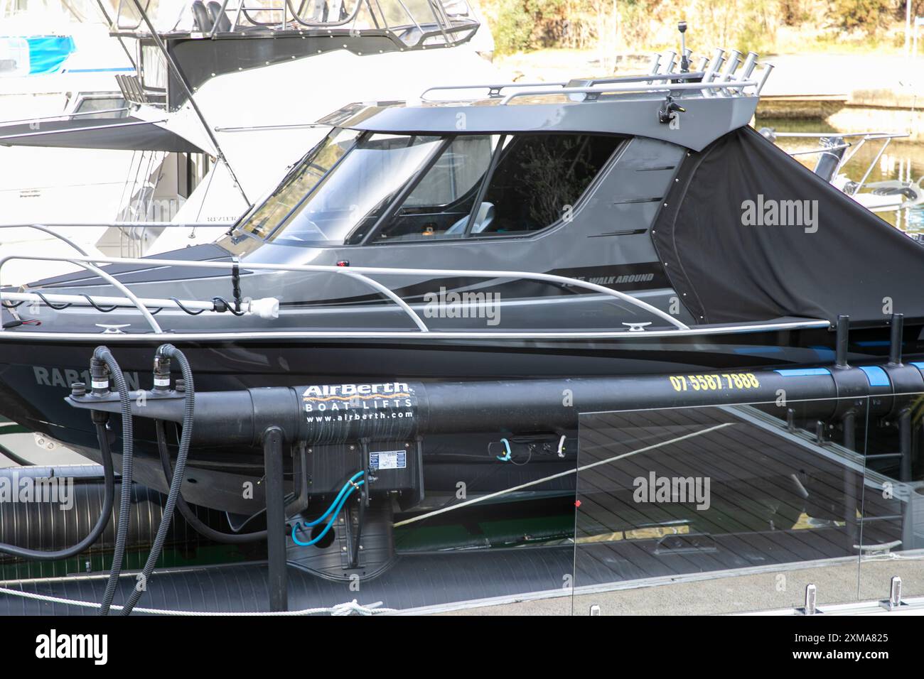 Extreme 795 walk around boat at Akuna Bay marina, berthed on an air berth in the marina,Sydney,NSW,Australia Stock Photo