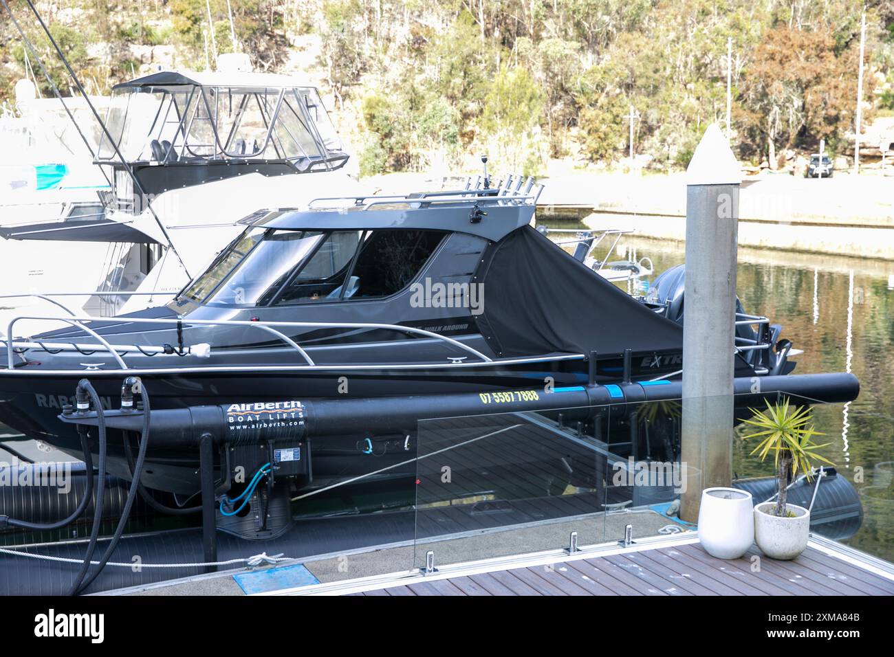 Extreme 795 walk around boat at Akuna Bay marina, berthed on an air berth in the marina,Sydney,NSW,Australia Stock Photo