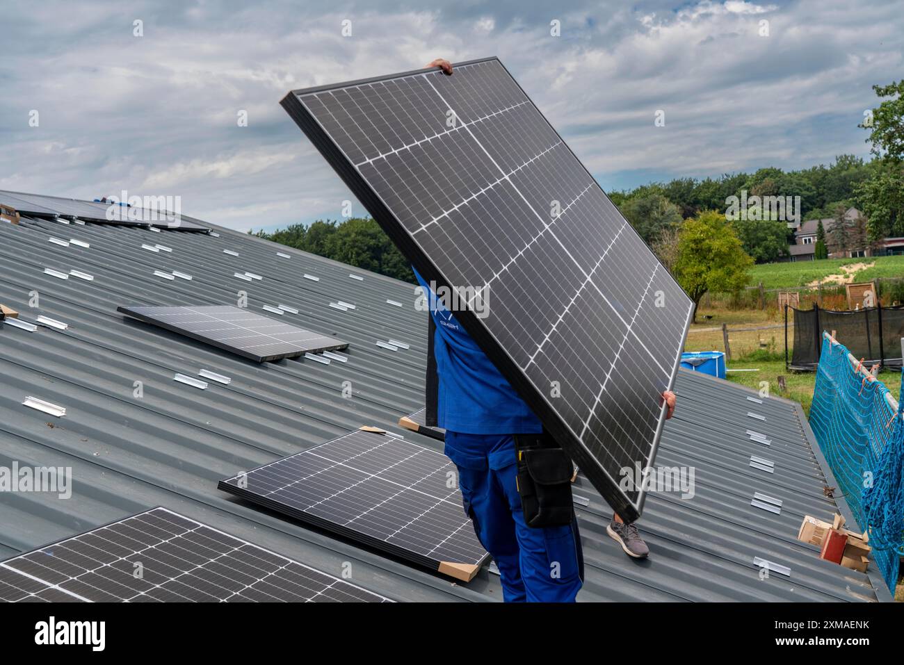 Installation of solar modules on the roof of a barn on a farm, over 240 ...