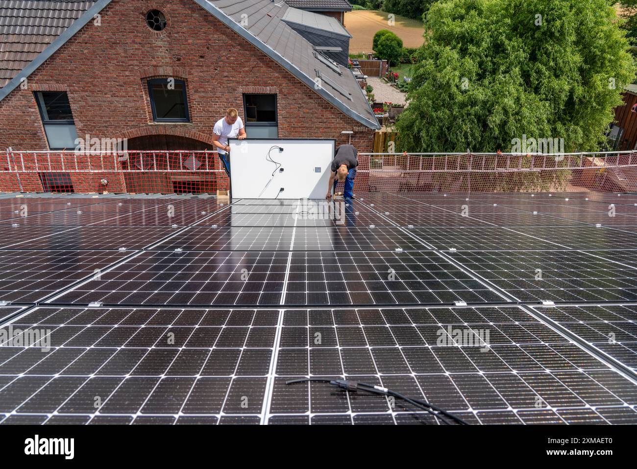 Installation of solar modules on the roof of a barn on a farm, over 210 ...