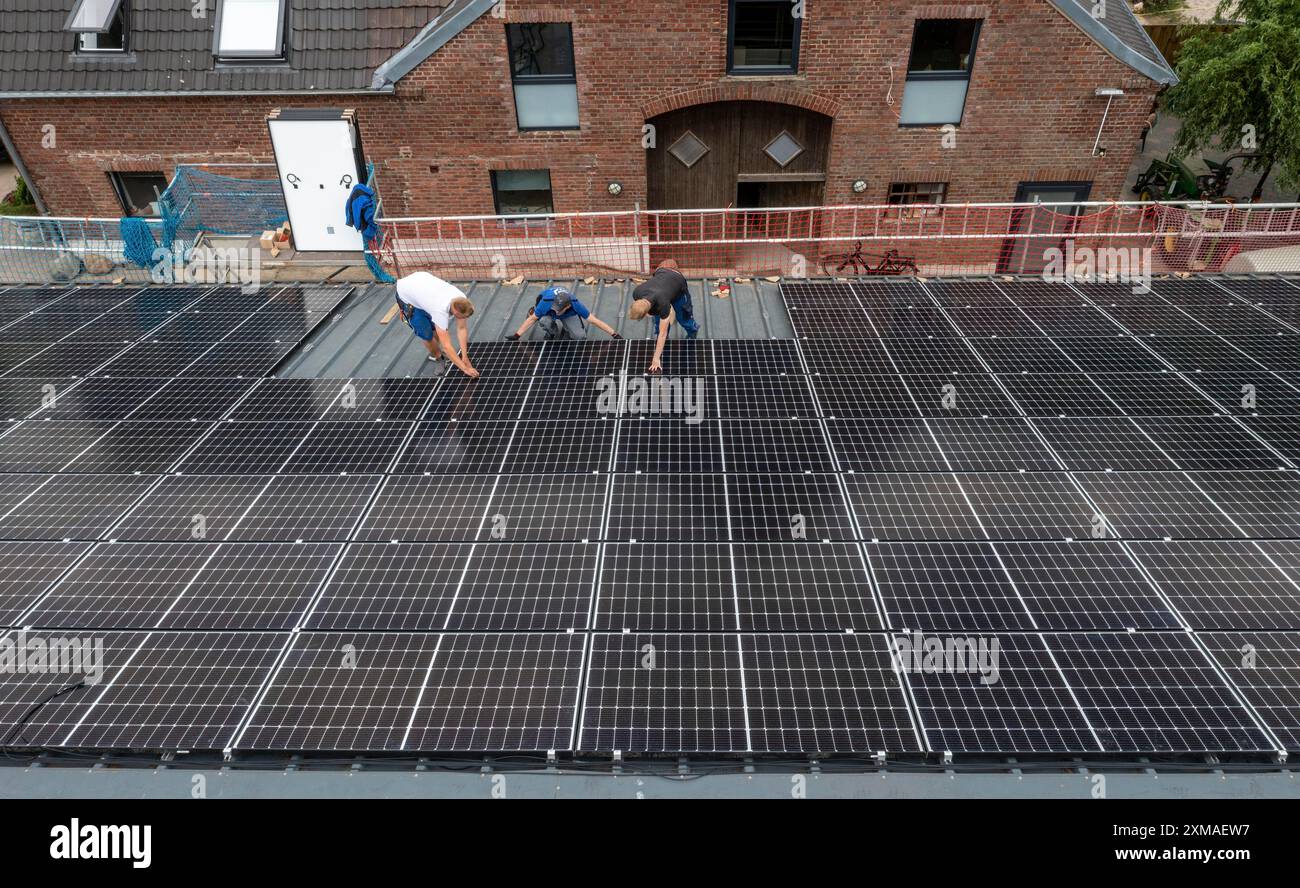 Installation of solar modules on the roof of a barn on a farm, over 210 ...
