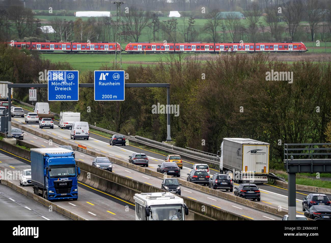 A3 motorway near Floersheim, in front of the Moenchhof motorway junction, narrowing of the lanes due to roadworks, regional train line, local train Stock Photo