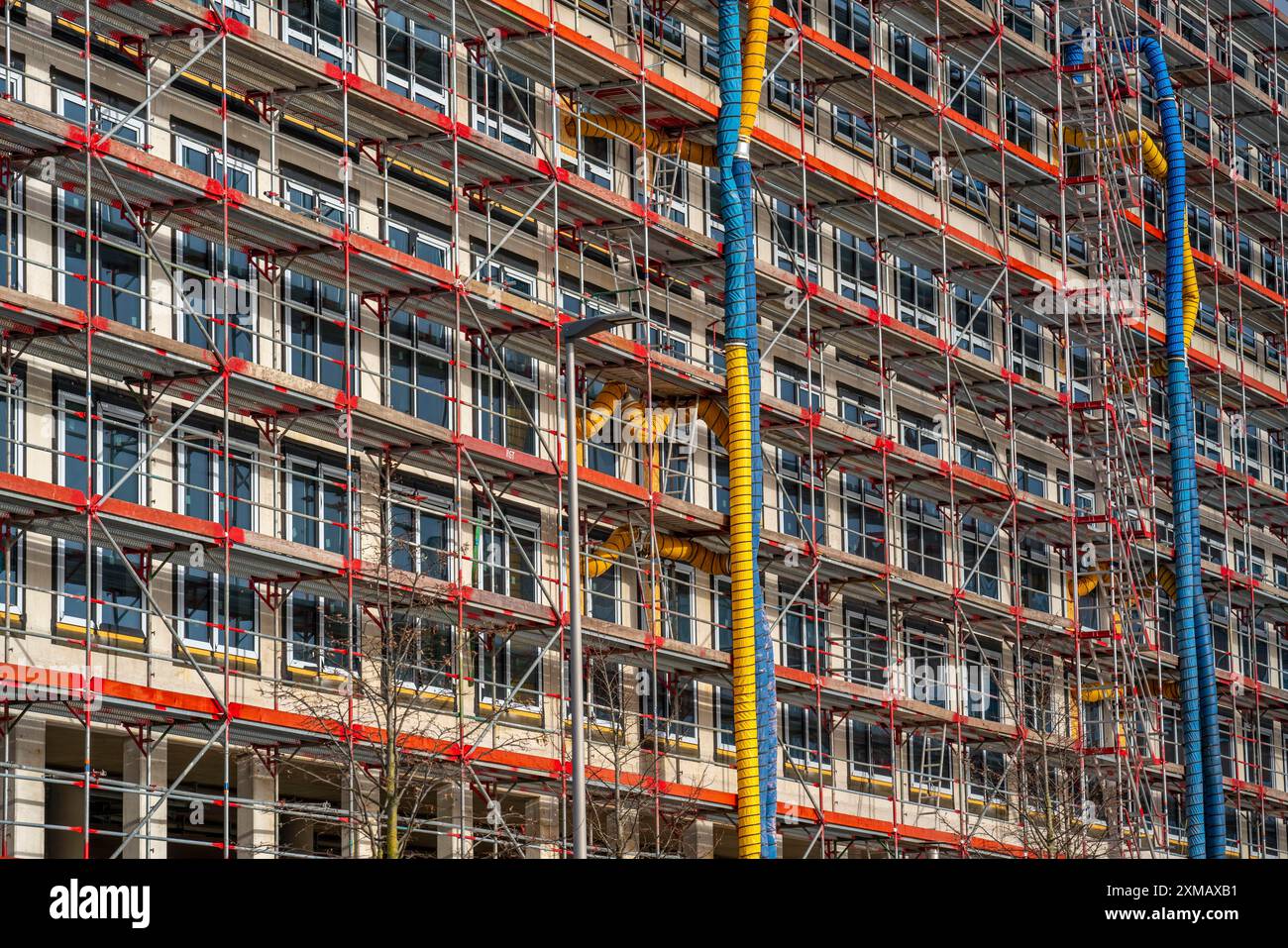 Hose Path Building Large construction site, scaffolded shell of an office building complex ...