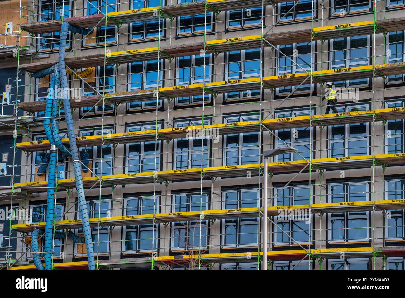 Hose Path Building Large construction site, scaffolded shell of an office building complex ...