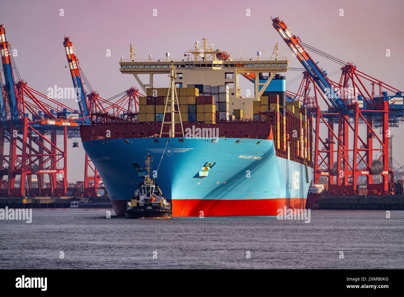 Magleby Maersk container freighter leaves Waltershof harbour after several days at EUROGATE Container Terminal, Hamburg, Germany Stock Photo