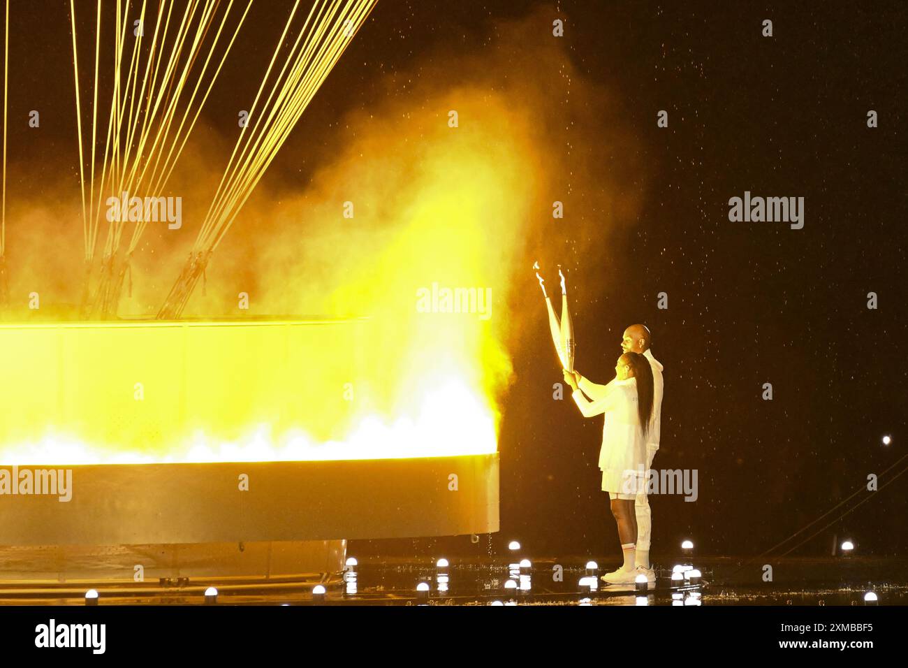 Teddy Riner and Marie-Jose Perec light the Olympic cauldron, Opening ...